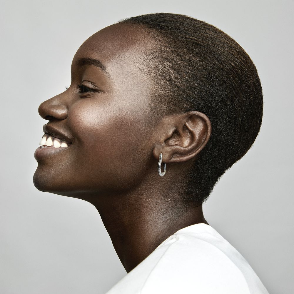 Woman wearing deals hoop earrings